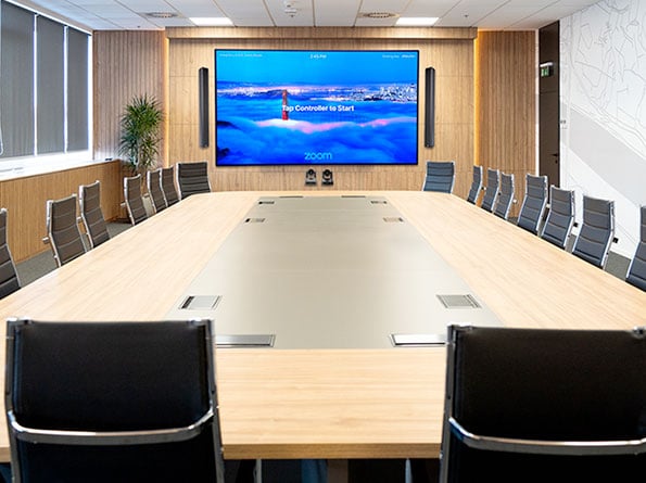 Image of a meeting room with Zoom
